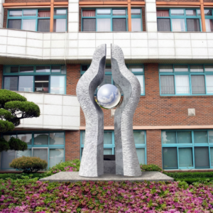 a modern stone sculpture consisting of two tall ve 1770241372133